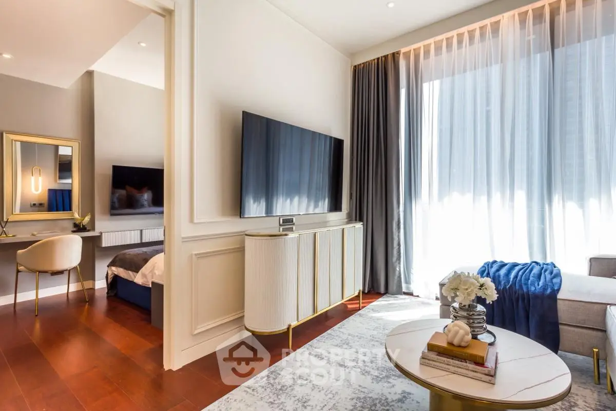 Luxurious modern living room with large TV and elegant decor