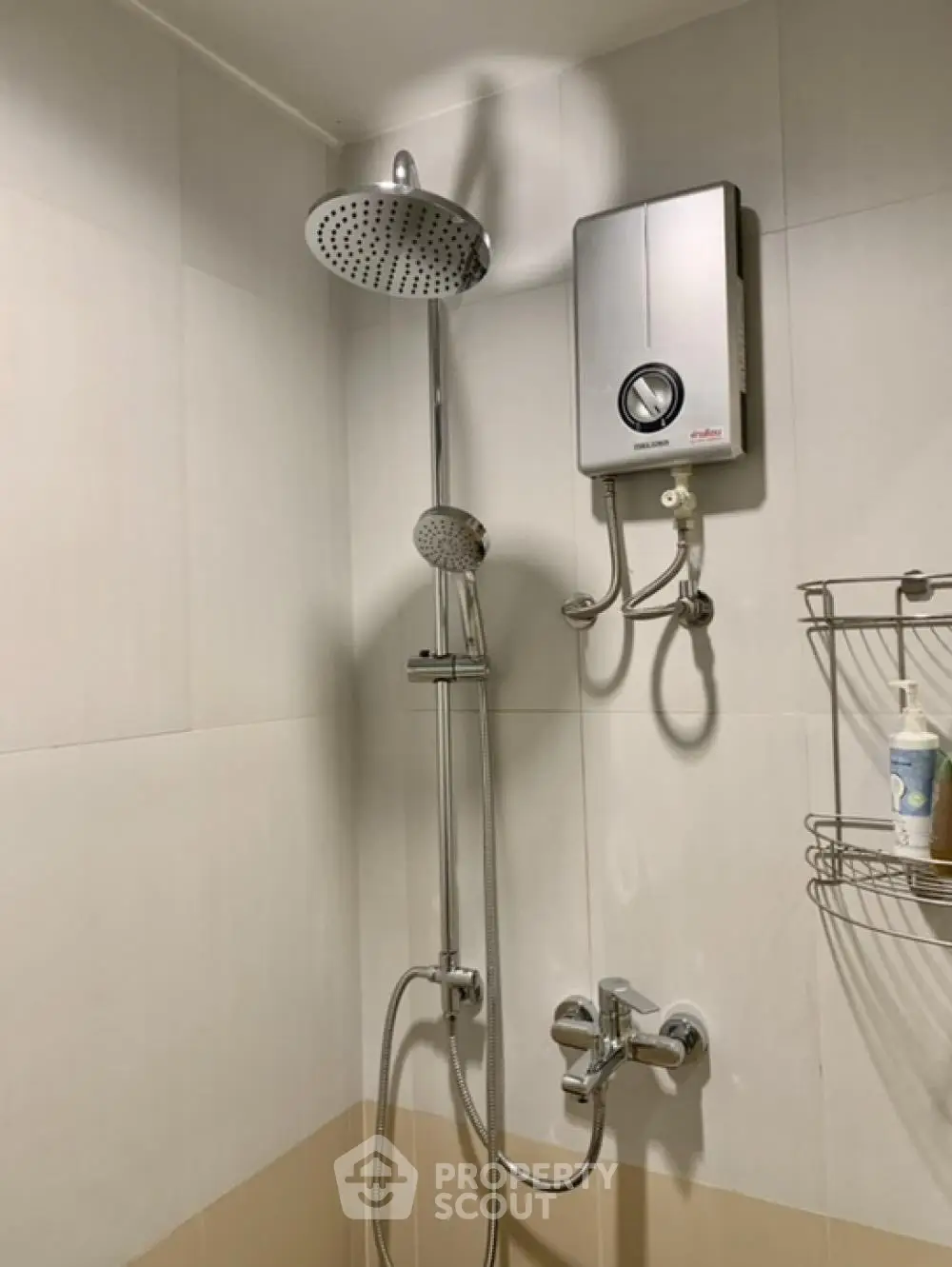 Modern bathroom with shower and water heater, sleek design for comfort and efficiency.