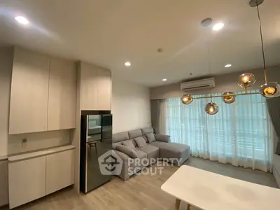 Modern living room with stylish lighting and comfortable gray sofa