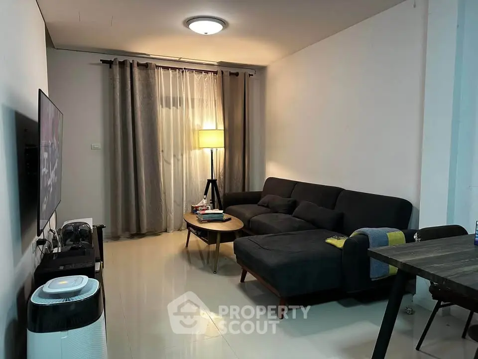 Cozy living room with modern sofa and ambient lighting