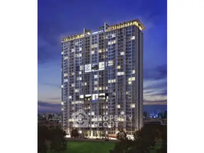 Stunning high-rise building with illuminated windows against a twilight sky, showcasing modern urban living.