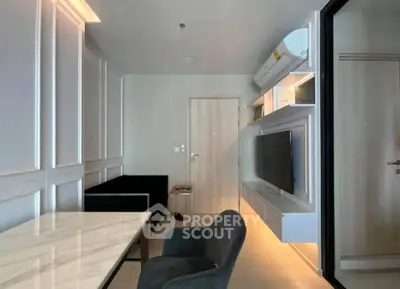 Modern living room with sleek furniture and wall-mounted TV, featuring elegant paneling and ambient lighting.