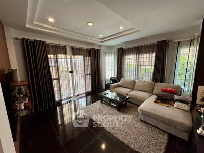 Spacious modern living room with large windows and stylish decor