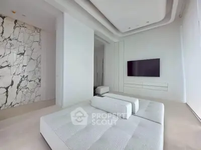 Luxurious modern living room with sleek design and marble accent wall