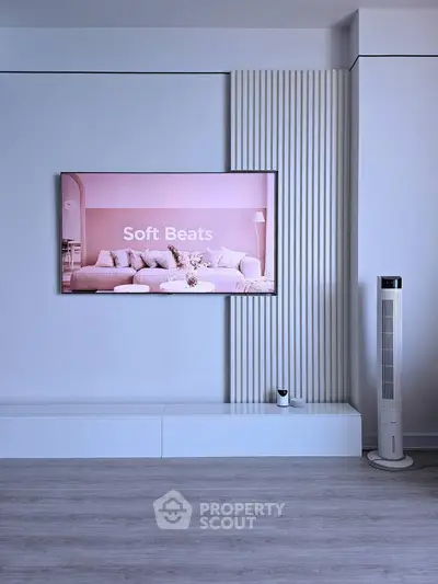 Modern living room with stylish decor and sleek fan, perfect for relaxation.