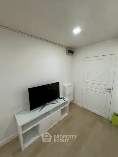 Modern minimalist living room with TV and white furniture