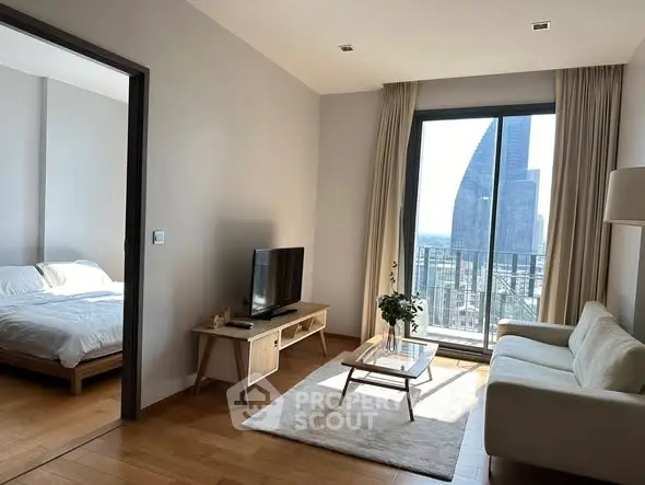 Modern living room with city view, featuring cozy sofa and stylish decor, adjacent to a bright bedroom.