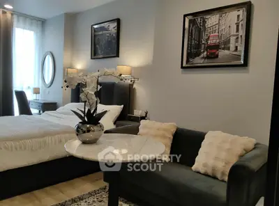 Chic bedroom with cozy seating area and stylish decor