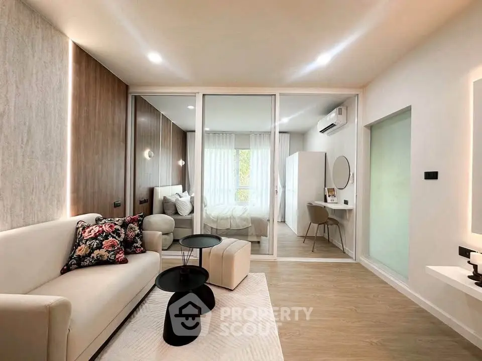 Modern living room with elegant decor and cozy bedroom view