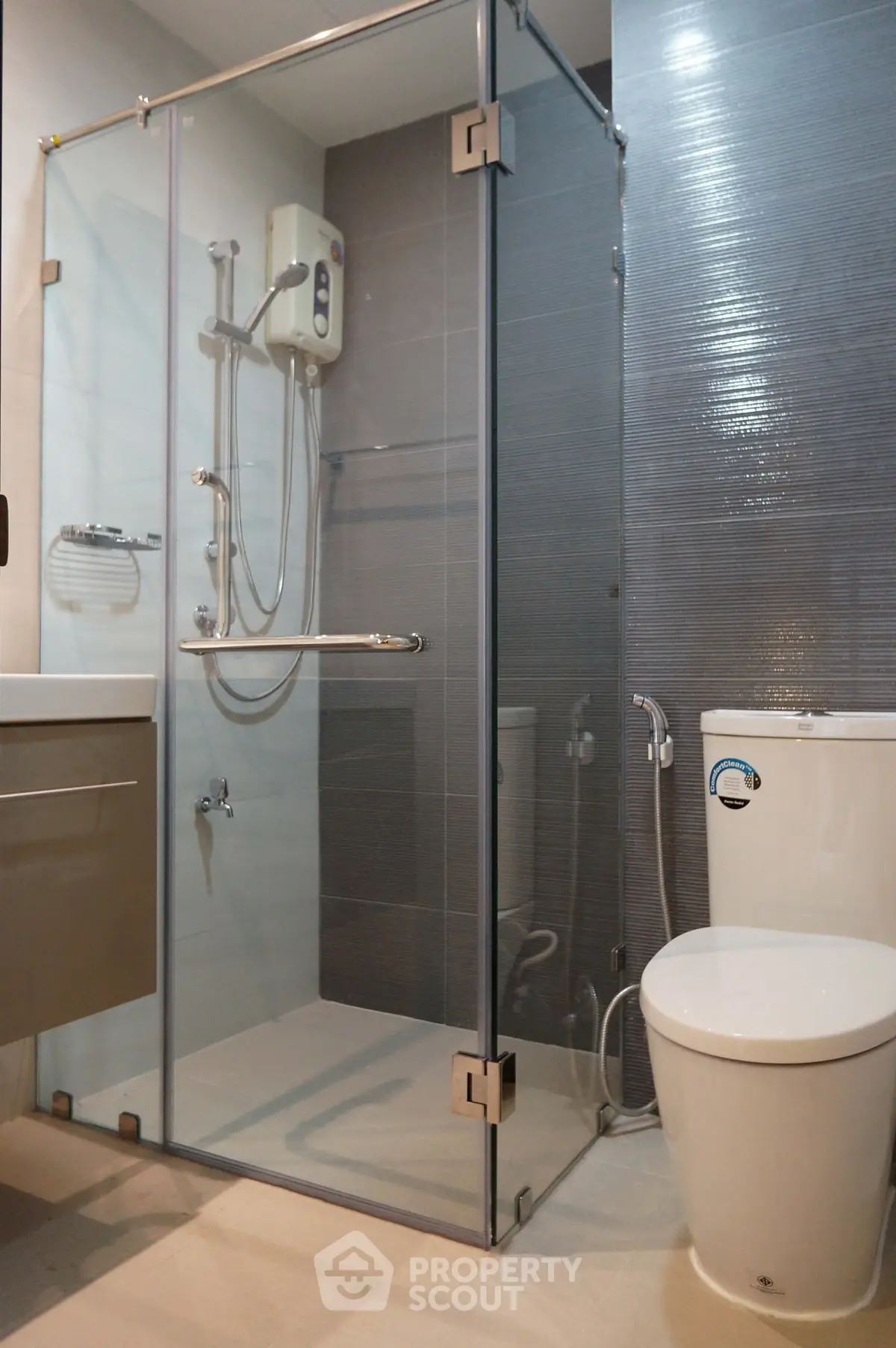 Modern bathroom with glass shower enclosure and sleek fixtures