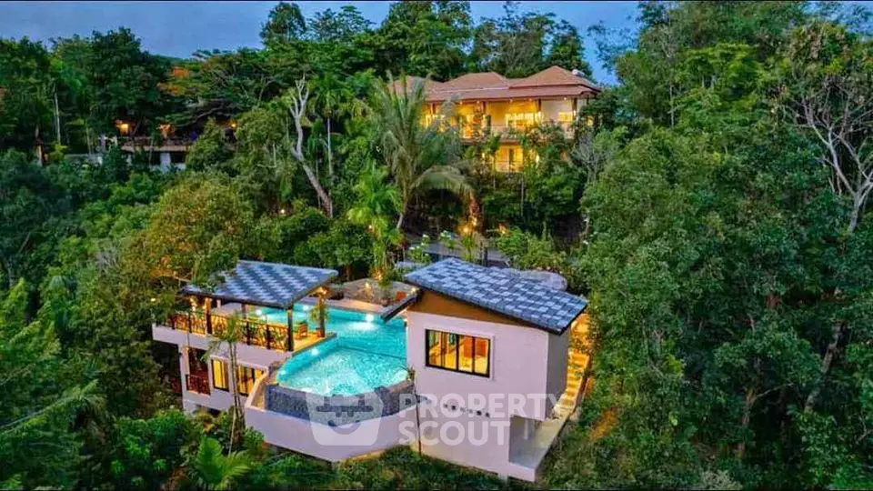 Luxurious hillside villa with stunning infinity pool and lush greenery