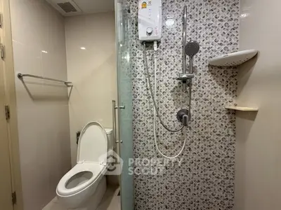 Modern bathroom with stylish shower and toilet in a contemporary apartment.
