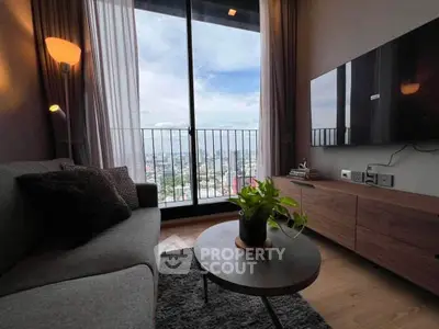 Modern living room with city view, stylish furniture, and floor-to-ceiling windows.
