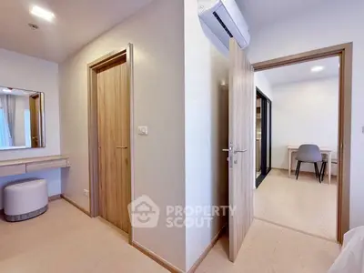 Modern bedroom with sleek wooden doors and minimalist furniture design