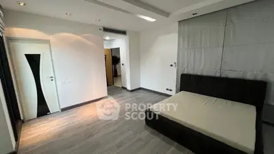 Spacious modern bedroom with sleek design and minimalist decor