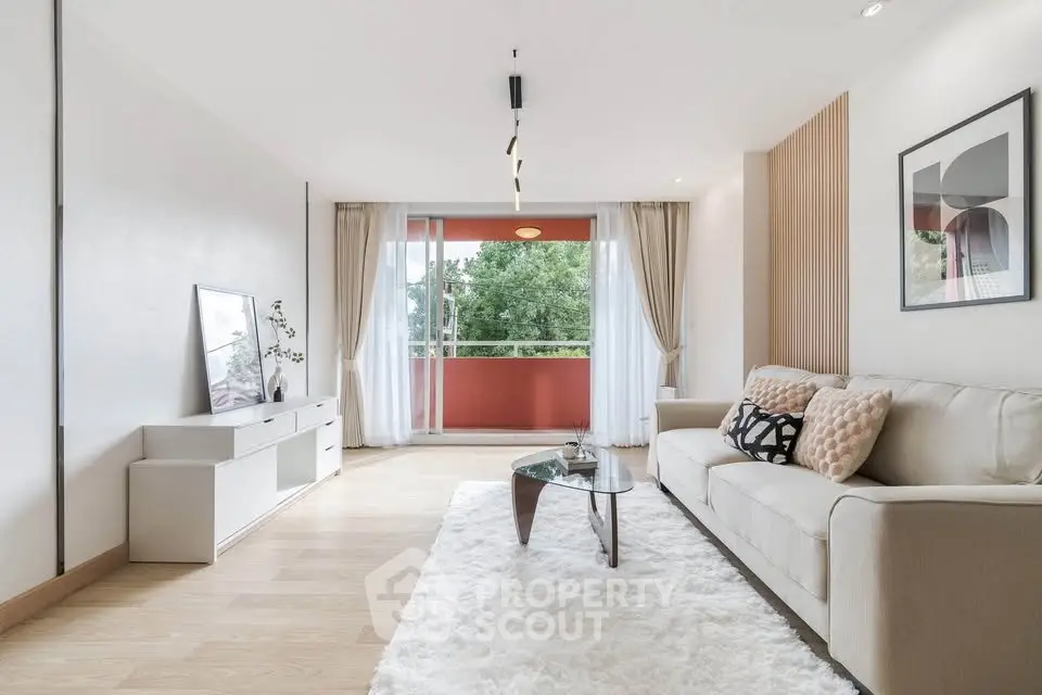 Spacious modern living room with large balcony and stylish decor