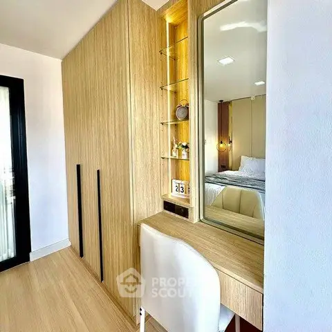 Modern bedroom with built-in wardrobe and stylish vanity area