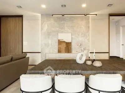 Modern living room with elegant dining area and stylish decor