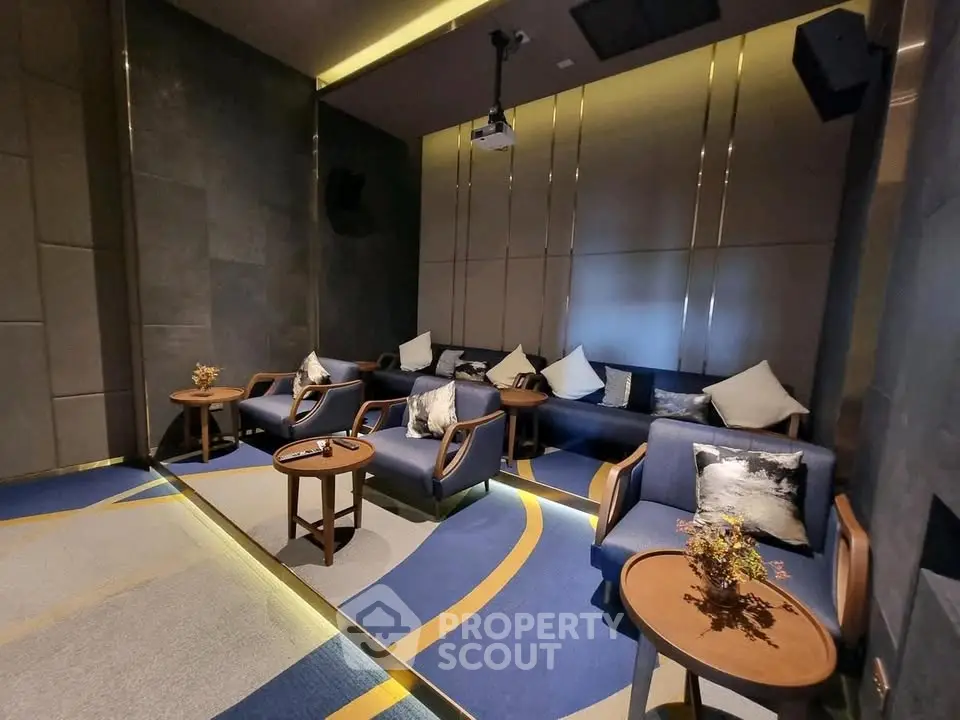 Luxurious home theater room with plush seating and modern decor