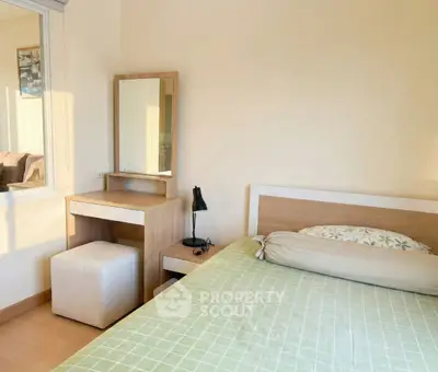 Cozy bedroom with natural light and modern furniture