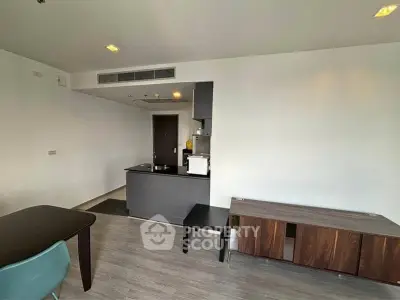 Modern apartment interior with sleek kitchen and stylish furniture, perfect for urban living.