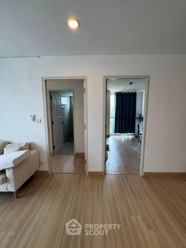 Spacious apartment interior with wooden flooring and modern design