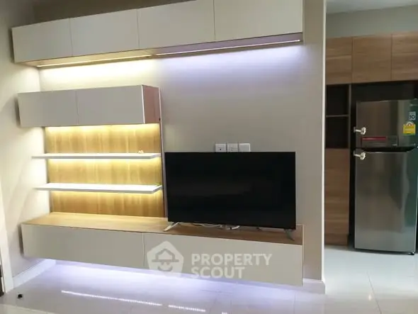 Modern living room with sleek TV unit and ambient lighting