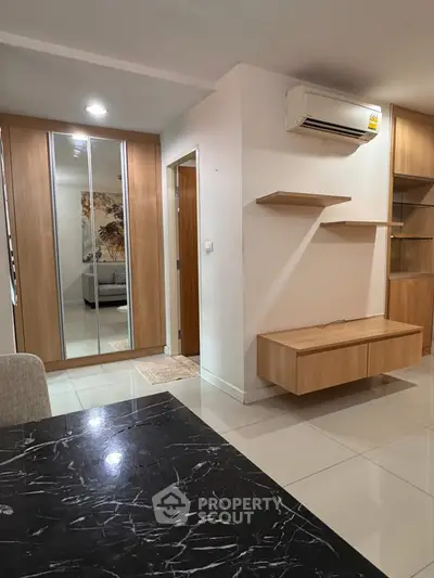 Modern apartment interior with sleek wooden furniture and marble dining table