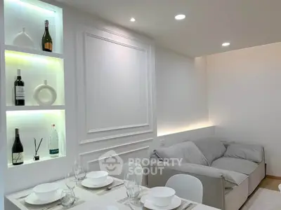 Elegant living room with modern decor and built-in illuminated shelves, perfect for stylish urban living.