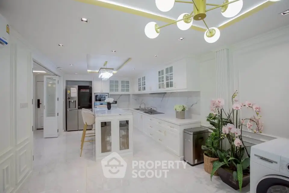 Luxurious modern kitchen with marble countertops and elegant lighting