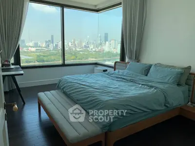 Luxurious bedroom with stunning city view and modern furnishings