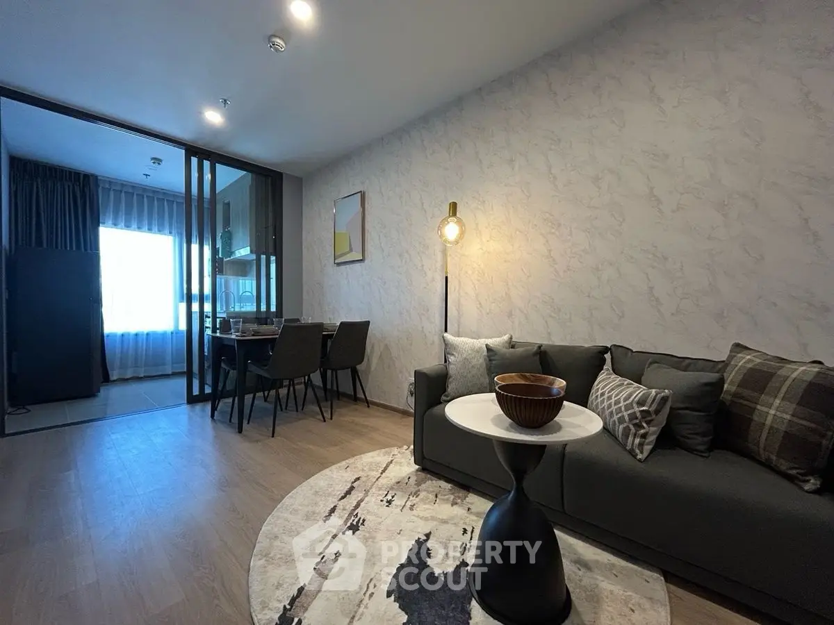 Modern living room with stylish decor and open dining area