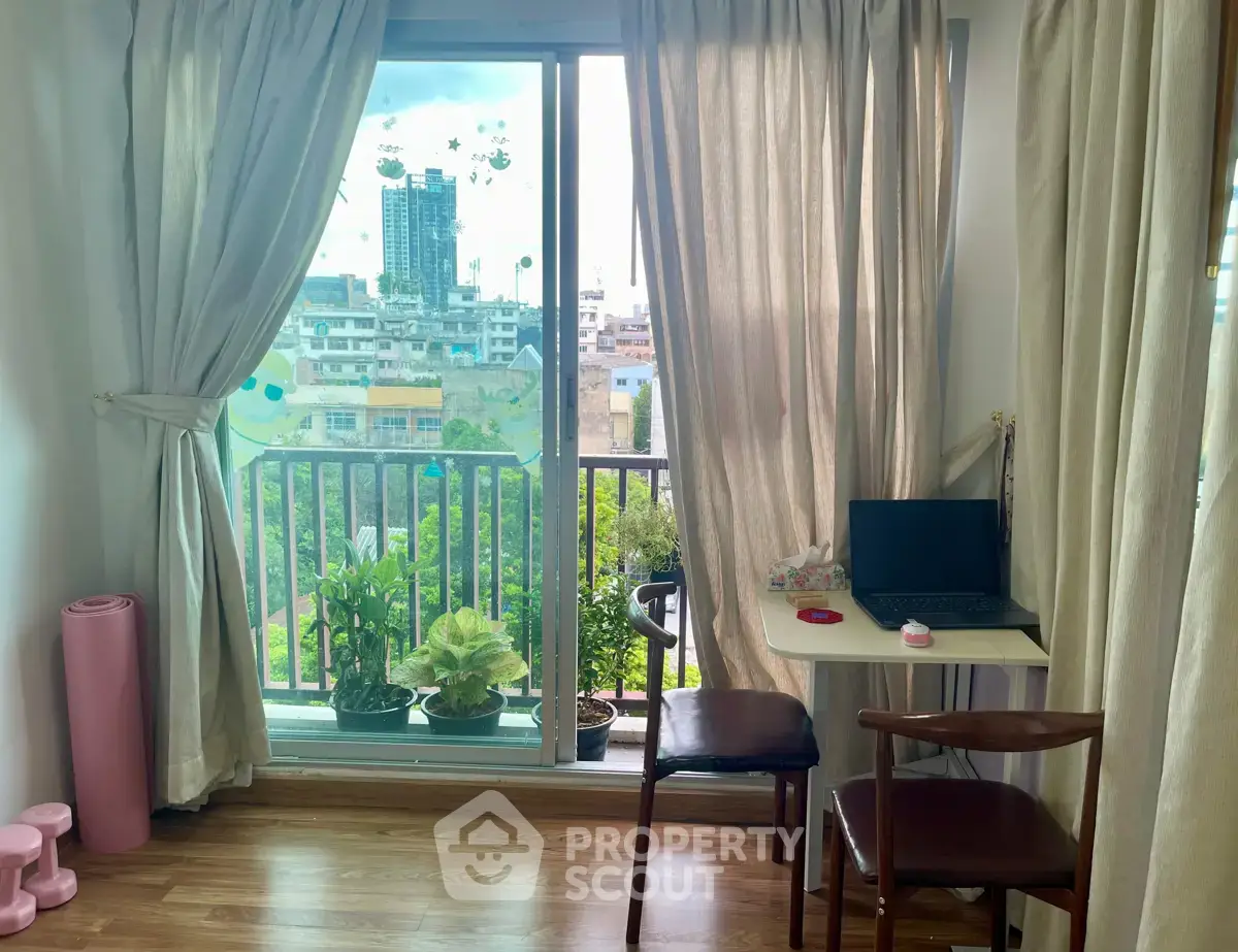 Bright study area with balcony view in modern apartment