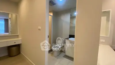 Modern bathroom with sleek design and vanity area in a stylish apartment
