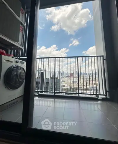 Modern apartment balcony with city view and washing machine, perfect for urban living.