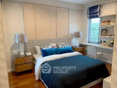 Modern bedroom with stylish decor and natural light