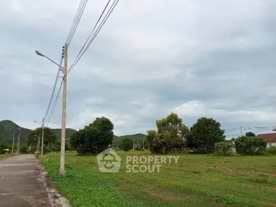 Expansive green land with scenic views, perfect for development or investment opportunities.