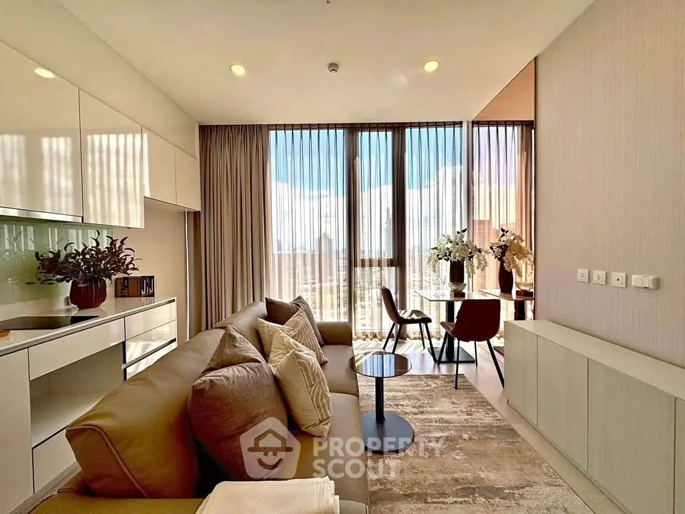 Modern living room with floor-to-ceiling windows and stylish decor in a high-rise apartment.