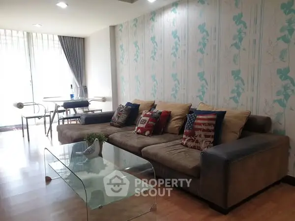 Spacious living room with stylish decor and natural light