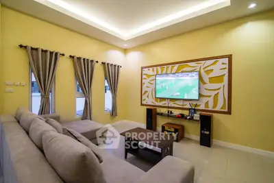 Spacious living room with modern decor and large wall-mounted TV
