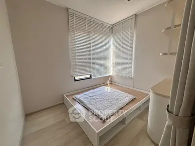 Modern minimalist bedroom with natural light and stylish blinds