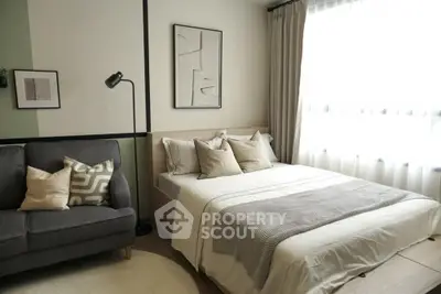 Modern bedroom with cozy bed, stylish decor, and natural light