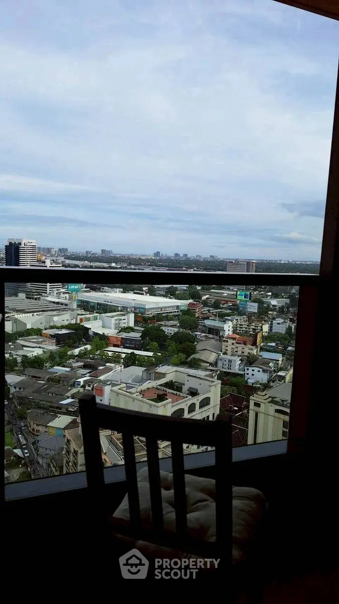 Stunning cityscape view from high-rise window with expansive skyline.