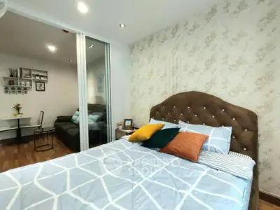 Cozy bedroom with stylish decor and comfortable bedding in modern apartment.