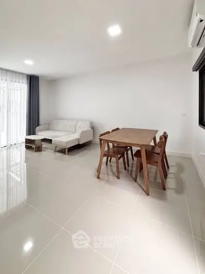 Modern living room with sleek furniture and natural light