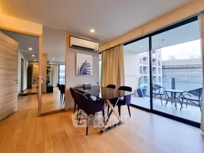 Modern dining area with balcony view in stylish apartment