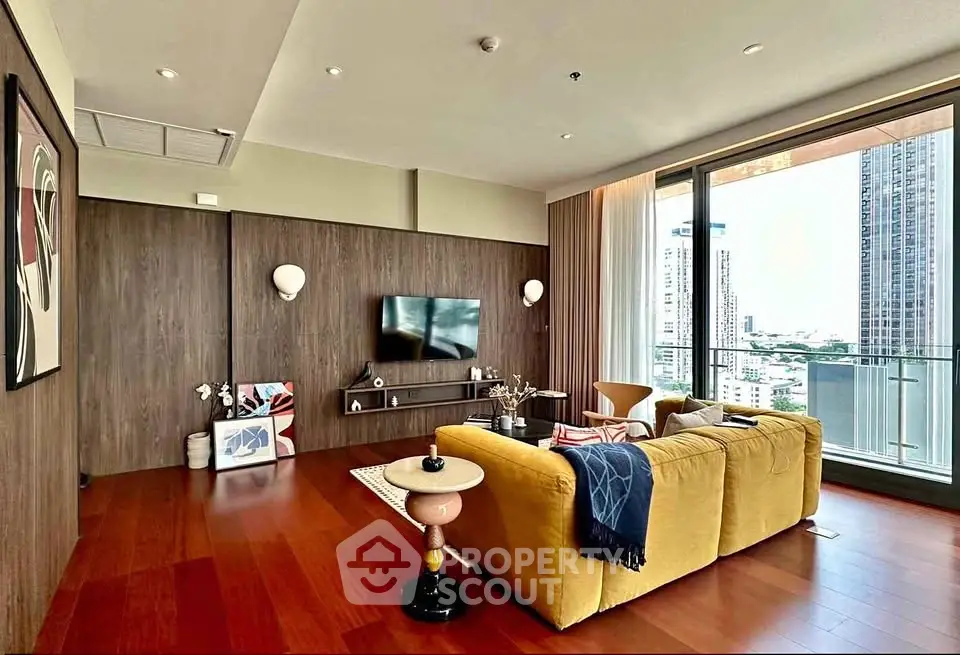 Luxurious living room with modern decor and stunning city view from large windows.