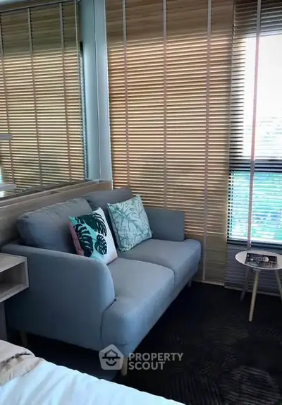 Cozy bedroom corner with stylish sofa and modern decor