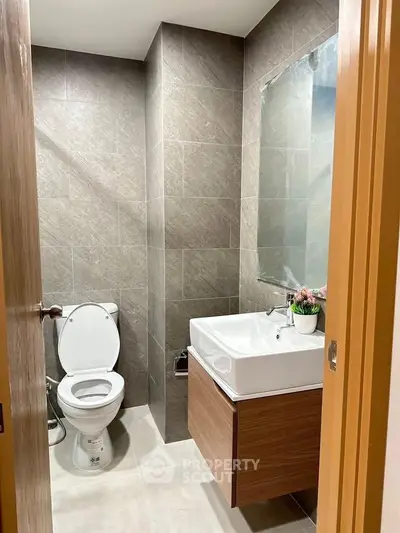 Modern bathroom with sleek design and elegant fixtures in a contemporary home.