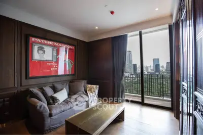 Luxurious living room with city view and elegant decor in high-rise apartment.